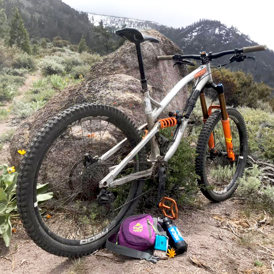 Bike Outside leaning on granite rock in Lake Tahoe