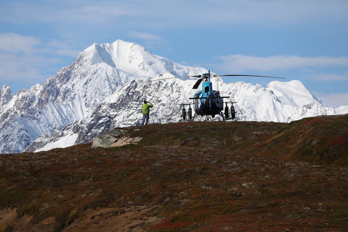 Tordrillo Mountain Lodge heli biking in Alaska through glaciers